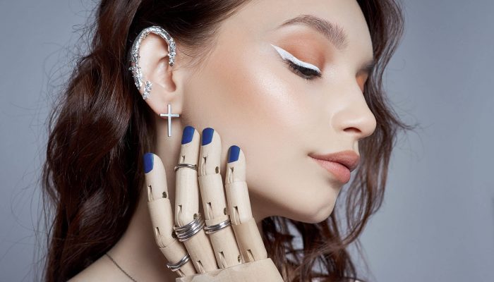 beauty-portrait-woman-with-natural-makeup-painted-polished-nails-her-hand